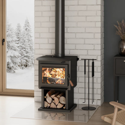 Small Wood-burning stove by Blaze King with fire lit inside, surrounded by a snowy landscape outside a window, wih wood logs stored below.
